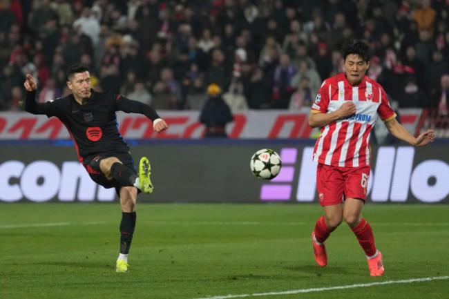 barcelonas-robert-lewandowski-shoots-by-red-stars-seol-young-woo-during-the-champions-league-opening-phase-soccer-match-between-red-star-and-barcelona-at-the-rajko-mitic-stadium-in-belgrade-serbia