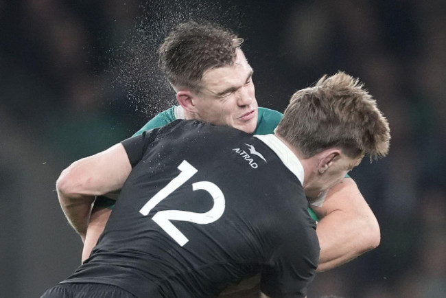 irelands-garry-ringrose-left-and-new-zealands-jordie-barrett-battle-for-the-ball-during-the-autumn-international-match-at-aviva-stadium-dublin-picture-date-friday-november-8-2024