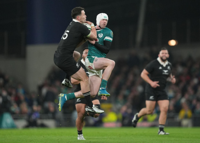 new-zealands-will-jordan-left-and-irelands-mack-hansen-battle-for-the-ball-during-the-autumn-international-match-at-aviva-stadium-dublin-picture-date-friday-november-8-2024