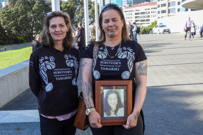 gina-right-and-tanya-sammons-hold-a-photo-of-their-late-sister-alva-as-they-arrive-at-parliament-house-in-wellington-new-zealand-ahead-of-the-apology-to-the-survivors-of-abuse-in-state-faith-base