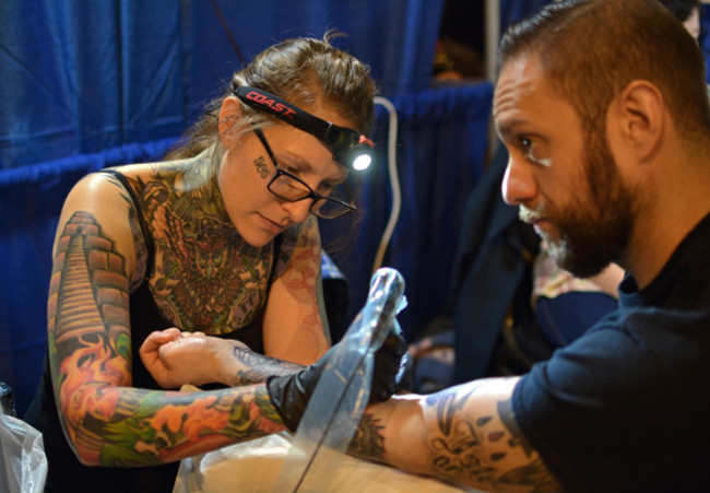 man-getting-a-forearm-tattoo-at-the-new-york-tattoo-convention-in-manhattan-at-the-roseland-ballroom-in-new-york-city