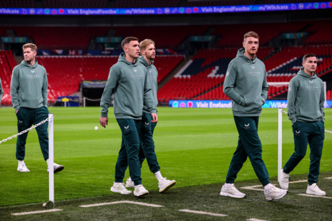 dara-oshea-caoimhin-kelleher-and-mark-travers-inspect-the-pitch