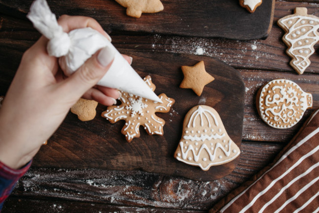 christmasbakery-decoratingfreshlybakedgingerbreadcookieswithicingview