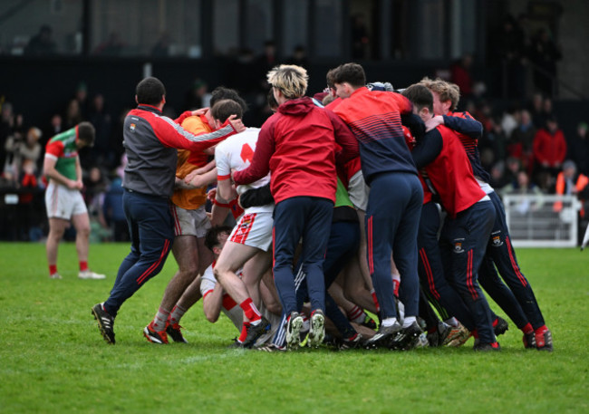 coolera-stranhill-players-celebrate-with-ross-doherty-after-he-scored-the-winning-penalty