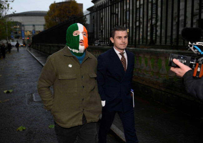 jj-odochartaigh-left-also-known-as-dj-provai-of-the-belfast-based-rap-group-kneecap-arrives-at-belfast-high-court-with-his-lawyer-darragh-mackin-where-the-irish-language-rap-trio-has-won-its-le