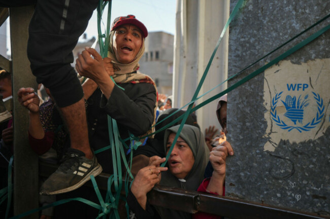 women-line-up-in-front-of-a-bakery-to-get-their-share-of-bread-in-deir-al-balah-gaza-strip-thursday-nov-21-2024-ap-photoabdel-kareem-hana