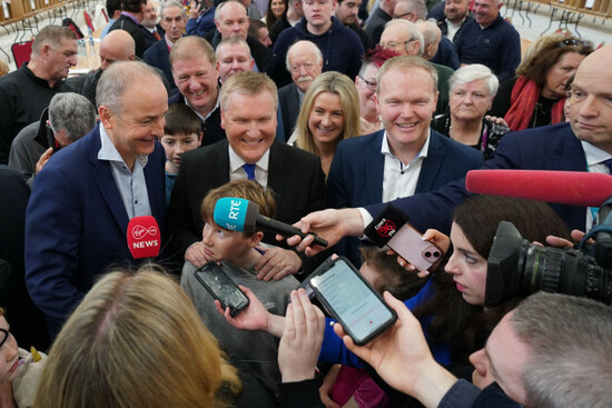 fianna-fail-leader-micheal-martin-congratulates-seamus-mcgrath-as-he-celebrates-with-his-brother-and-incoming-eu-commissioner-michael-mcgrath-after-being-elected-in-cork-south-central-at-the-electio