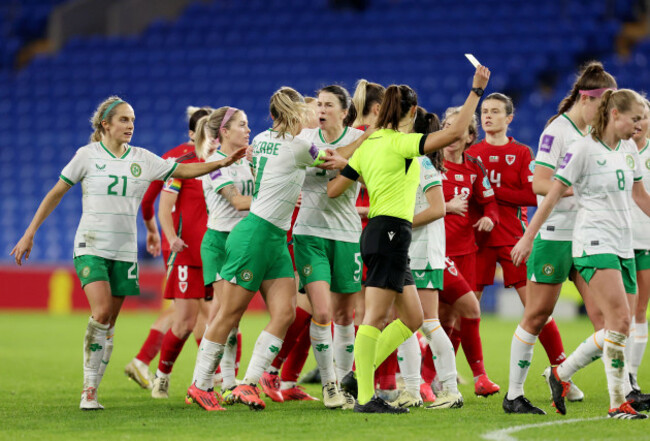 cardiff-uk-29th-nov-2024-republic-of-irelands-katie-mccabe-is-held-back-by-teammate-niamh-fahey-as-tempers-flare-between-players-of-wales-and-republic-of-ireland-during-the-2025-european-womens