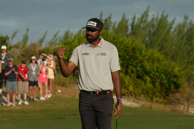 sahith-theegala-of-the-united-states-reacts-after-making-an-birdie-on-the-18th-hole-during-the-first-round-of-the-hero-world-challenge-pga-tour-at-the-albany-golf-club-in-new-providence-bahamas-t