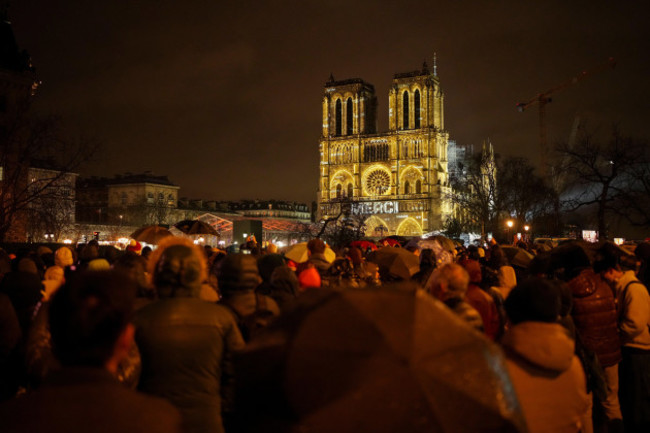 spectators-gather-outside-frances-iconic-notre-dame-cathedral-saturday-dec-7-2024-in-paris-for-its-formal-reopening-for-the-first-time-since-a-devastating-fire-nearly-destroyed-the-861-year-old-l