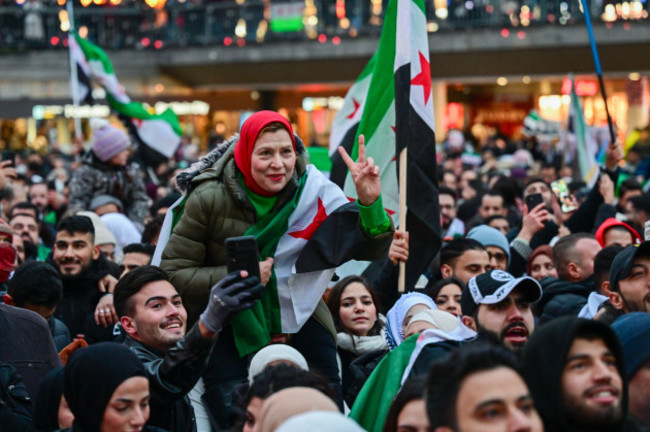 stockholm-sweden-08th-dec-2024-stockholm-sweden-20241208syrians-celebrate-the-fall-of-the-assad-regime-in-syria-at-a-demonstration-on-sergels-square-in-stockholm-sweden-on-sunday-8-december-2