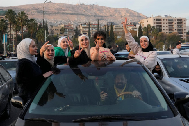 syrian-citizens-celebrate-during-the-second-day-of-the-take-over-of-the-city-by-the-insurgents-in-damascus-syria-monday-dec-9-2024-ap-photohussein-malla