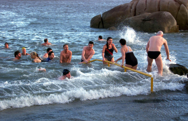 swimmers-from-around-the-country-take-an-annual-christmas-day-swim-for-charity-in-the-irish-sea-at-the-forty-foot-sandycove-near-dublin