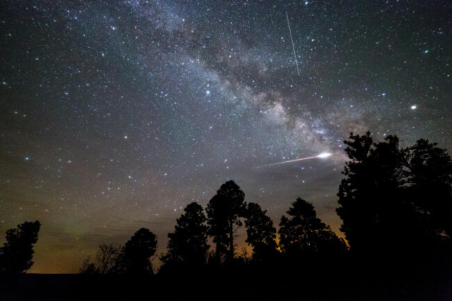 an-eta-aquarid-meteor-exploding-over-pine-trees-on-the-coconino-rim-along-the-arizona-trail-kaibab-national-forest-arizona