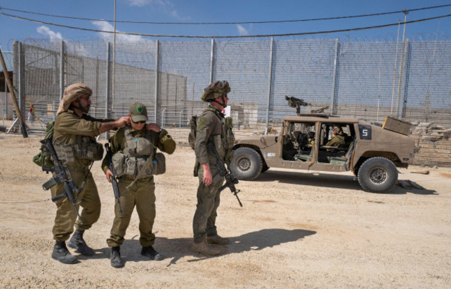 erez-crossing-israel-05th-may-2024-israeli-soldiers-at-their-humvee-at-the-erez-crossing-checkpoint-as-they-watch-israeli-trucks-entering-and-returning-to-israel-after-delivering-humanitarian-aid