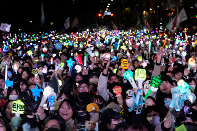 participants-gather-to-celebrate-after-south-koreas-parliament-voted-to-impeach-president-yoon-suk-yeol-outside-the-national-assembly-in-seoul-south-korea-saturday-dec-14-2024-ap-photoahn-you