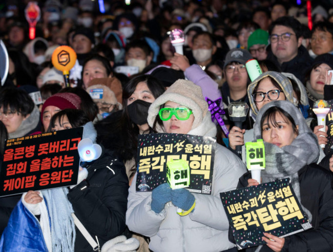 seoul-south-korea-14th-dec-2024-south-korean-protesters-celebrate-following-the-passage-of-an-impeachment-motion-against-president-yoon-suk-yeol-during-a-rally-outside-the-national-assembly-in-se