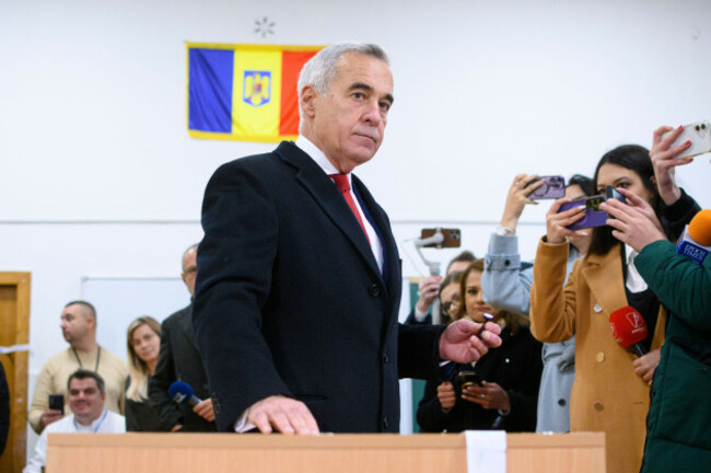 calin-georgescu-an-independent-candidate-for-president-who-came-first-after-the-first-round-of-presidential-elections-casts-his-vote-in-the-countrys-parliamentary-elections-in-mogosoaia-romania