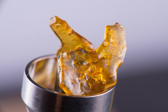 macro-detail-of-piece-of-cannabis-oil-concentrate-aka-shatter-on-a-titanium-dab-rig