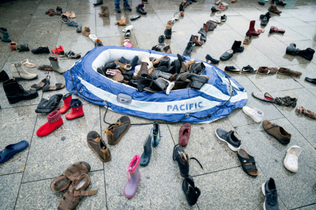 a-rubber-dinghy-and-around-200-pairs-of-shoes-lie-in-the-station-forecourt-as-an-installation-for-a-vigil-for-the-5th-anniversary-of-the-death-of-child-migrant-alan-kurdi-the-body-of-3-year-old-syria