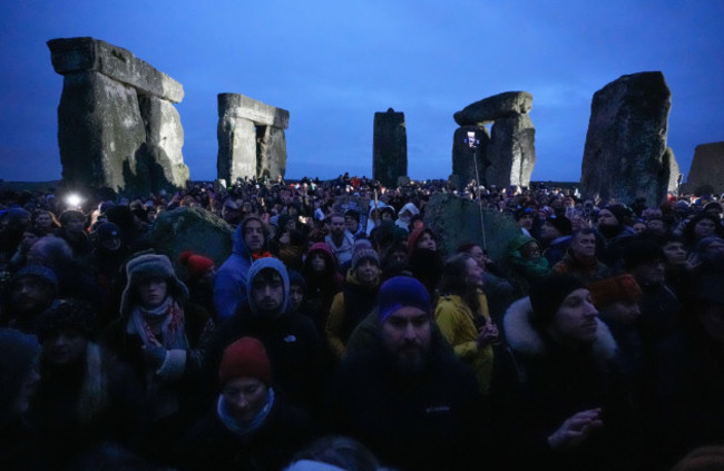 people-take-part-in-the-winter-solstice-celebrations-during-sunrise-at-the-stonehenge-prehistoric-monument-on-salisbury-plain-in-wiltshire-picture-date-saturday-december-21-2024