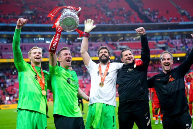 liverpool-goalkeeper-alisson-centre-adrian-caoimhin-kelleher-and-the-coaching-staff-celebrate-after-winning-the-emirates-fa-cup-final-at-wembley-stadium-london-picture-date-saturday-may-14-20