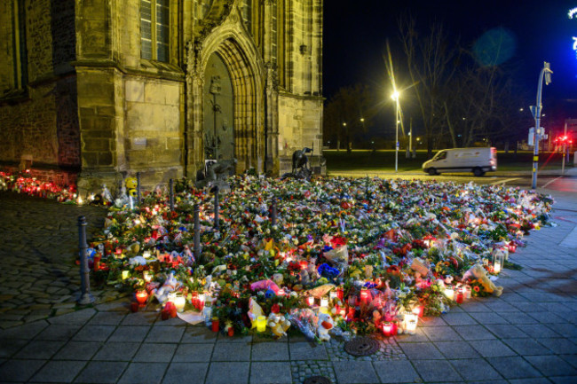 magdeburg-germany-23rd-dec-2024-flowers-candles-wreaths-and-stuffed-animals-lie-in-front-of-st-johns-church-on-december-20-2024-a-car-driver-drove-into-a-group-of-people-at-the-christmas-ma