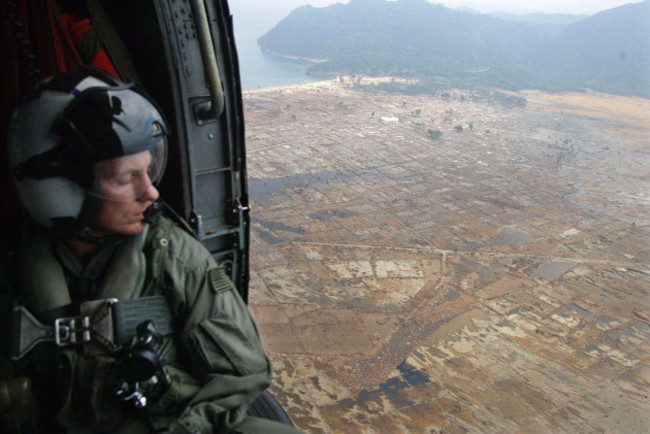 file-in-this-jan-4-2005-file-photo-senior-chief-petty-officer-james-cash-from-san-diego-california-surveys-damage-to-banda-aceh-town-from-the-tsunami-wave-from-a-united-states-naval-helicopter