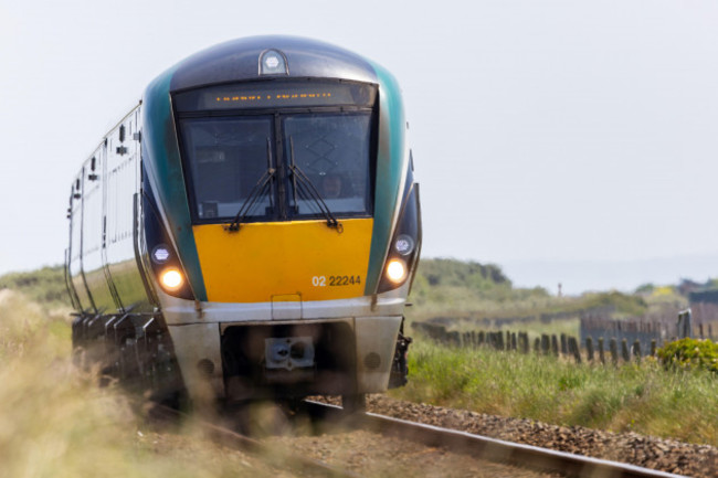 irish-rail-or-iarnrod-eireann-train-carriage-moving-or-travelling-on-railway-tracks-wicklow-ireland