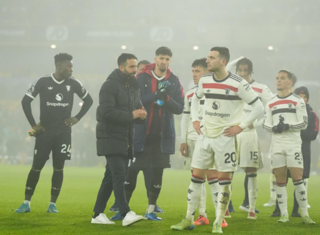 manchester-united-manager-ruben-amorim-second-left-and-his-players-leave-the-pitch-after-the-premier-league-match-at-molineux-stadium-wolverhampton-picture-date-thursday-december-26-2024