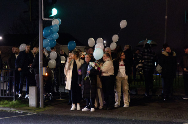 people-attend-a-vigil-at-the-scene-on-blanchardstown-road-north-west-dublin-where-two-pedestrians-were-killed-in-a-hit-and-run-incident-on-boxing-day-the-couple-have-been-named-locally-as-anthony-h