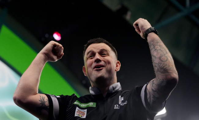 luke-woodhouse-celebrates-winning-during-his-third-round-match-against-damon-heta-on-day-ten-of-the-paddy-power-world-darts-championship-at-alexandra-palace-london-picture-date-friday-december-27