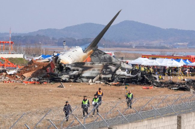 firefighters-and-rescue-team-members-work-near-the-wreckage-of-a-passenger-plane-at-muan-international-airport-in-muan-south-korea-sunday-dec-29-2024-ap-photoahn-young-joon