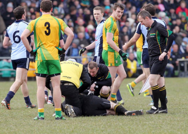 referee-paraic-hughes-is-attended-to-by-donegal-team-doctor-charlie-mcmanus