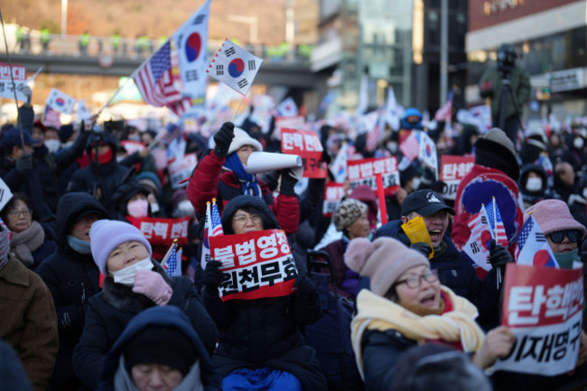 supporters-of-impeached-south-korean-president-yoon-suk-yeol-stage-a-rally-to-oppose-a-court-having-issued-a-warrant-to-detain-yoon-near-the-presidential-residence-in-seoul-south-korea-friday-jan