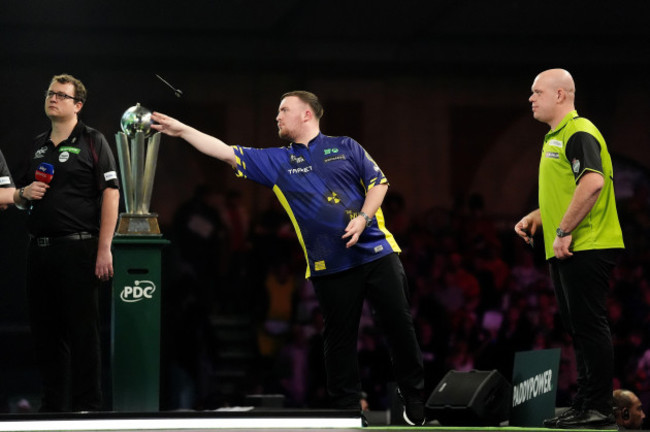 luke-littler-centre-in-action-during-the-paddy-power-world-darts-championship-final-against-michael-van-gerwen-right-at-alexandra-palace-london-picture-date-friday-january-3-2025