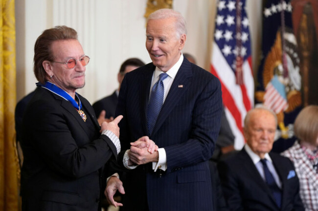 president-joe-biden-right-looks-on-after-presenting-the-presidential-medal-of-freedom-the-nations-highest-civilian-honor-to-bono-in-the-east-room-of-the-white-house-saturday-jan-4-2025-in-wa