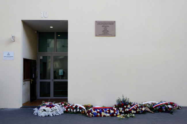 wreaths-are-placed-in-front-of-charlie-hebdos-former-offices-during-commemorations-marking-10-years-since-an-islamist-attack-on-the-charlie-hebdo-satirical-newspaper-and-the-hypercacher-jewish-superm