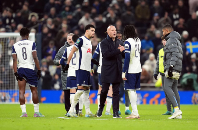 liverpool-manager-arne-slot-and-tottenham-hotspurs-djed-spence-after-the-final-whistle-of-the-carabao-cup-semi-final-first-leg-match-at-the-tottenham-hotspur-stadium-london-picture-date-wednesday