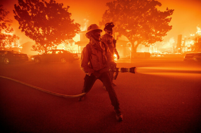 firefighters-battle-the-palisades-fire-as-it-burns-multiple-structures-in-the-pacific-palisades-neighborhood-of-los-angeles-tuesday-jan-7-2025-ap-photoethan-swope