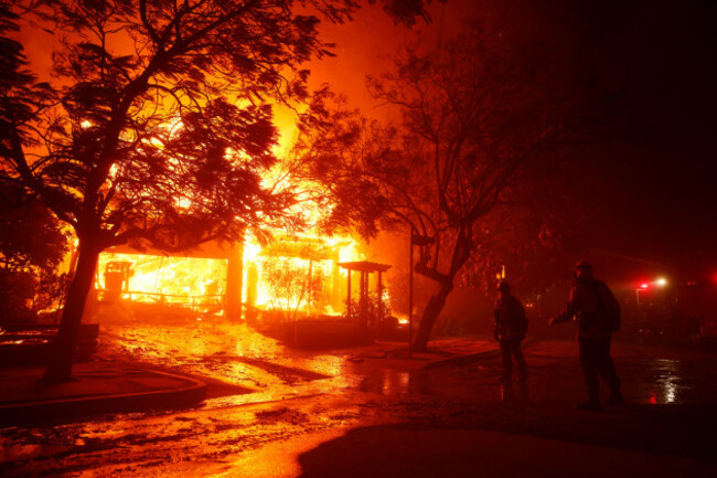 firefighters-battle-the-palisades-fire-in-the-pacific-palisades-neighborhood-of-los-angeles-tuesday-jan-7-2025-ap-photoetienne-laurent