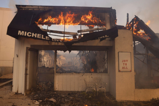 a-business-burns-while-the-palisades-fire-sweeps-through-in-the-pacific-palisades-neighborhood-of-los-angeles-wednesday-jan-8-2025-ap-photoetienne-laurent