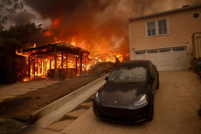 the-palisades-fire-burns-a-structure-in-the-pacific-palisades-neighborhood-of-los-angeles-wednesday-jan-8-2025-ap-photoetienne-laurent