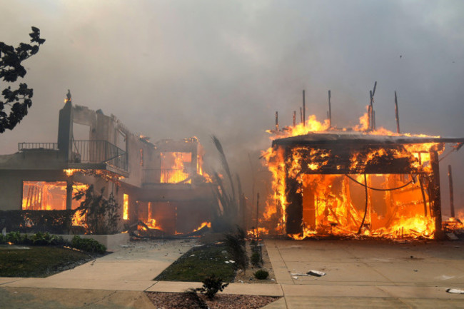 the-palisades-fire-ravages-a-neighborhood-amid-high-winds-in-the-pacific-palisades-neighborhood-of-los-angeles-wednesday-jan-8-2025-ap-photodamian-dovarganes