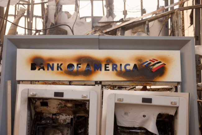 an-atm-is-damaged-at-a-bank-of-america-branch-after-the-palisades-fire-swept-through-in-the-pacific-palisades-neighborhood-of-los-angeles-wednesday-jan-8-2025-ap-photoetienne-laurent