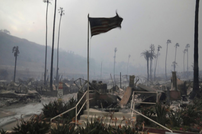 the-palisades-fire-ravages-a-neighborhood-amid-high-winds-in-the-pacific-palisades-neighborhood-of-los-angeles-wednesday-jan-8-2025-ap-photodamian-dovarganes