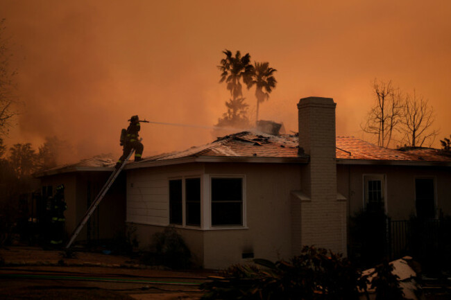 fire-crews-battle-the-eaton-fire-as-it-impacts-a-structure-thursday-jan-9-2025-in-altadena-calif-ap-photoeric-thayer