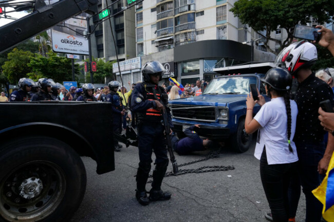 police-take-possession-of-the-truck-from-which-opposition-leader-maria-corina-machado-addressed-supporters-at-a-protest-in-caracas-venezuela-thursday-jan-9-2025-the-day-before-president-nicolas