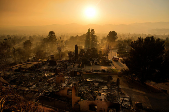 an-emergency-vehicle-drives-through-a-neighborhood-devastated-by-the-eaton-fire-thursday-jan-9-2025-in-altadena-calif-ap-photojohn-locher