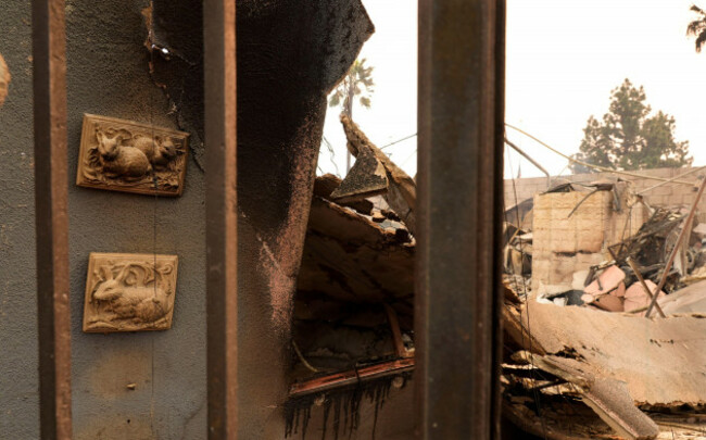 wall-art-at-left-featuring-bunnies-is-suspended-on-a-charred-wall-at-the-destroyed-bunny-museum-thursday-jan-9-2025-in-the-altadena-section-of-pasadena-calif-ap-photochris-pizzello